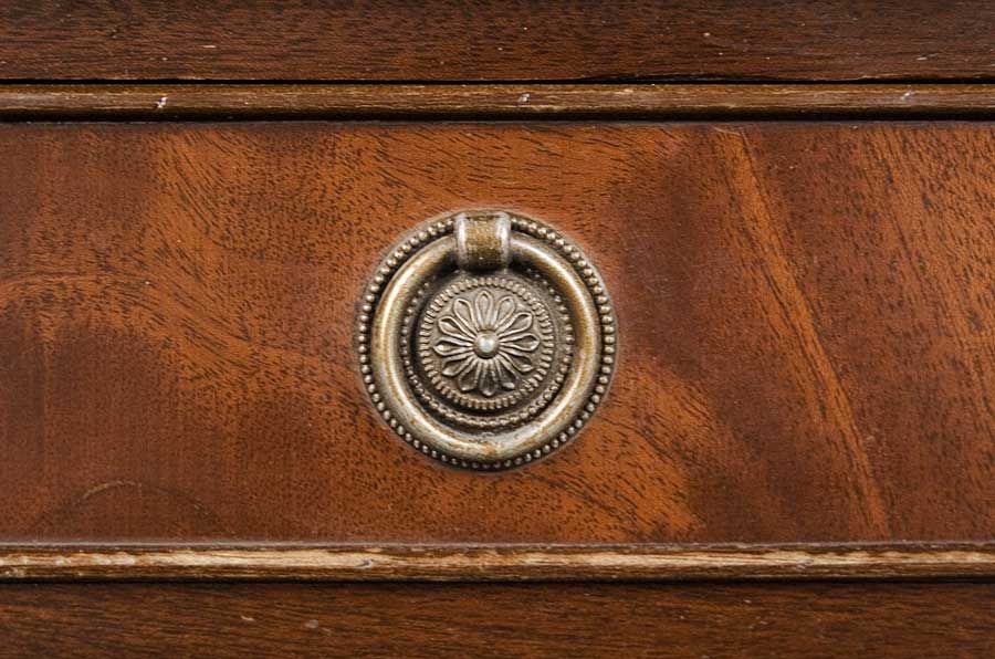 Round, brass, Edwardian style pulls adorn the drawer fronts.